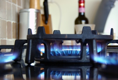 Fire in the kitchen and a bottle of wineの写真素材