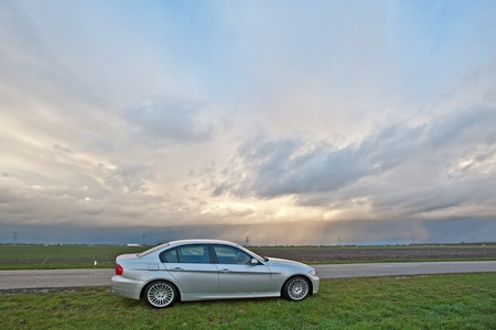 Car parked along a country road, Holland, Europeの写真素材