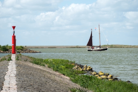 Sailing boat on a lake in springの写真素材