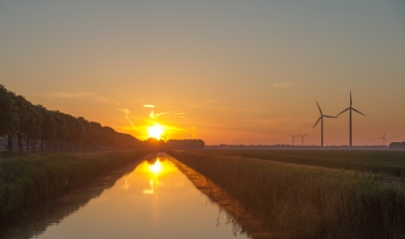 Dawn over a canal in springの写真素材