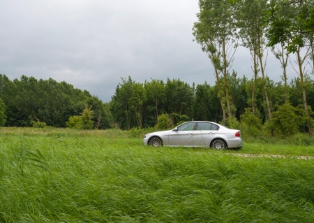 Car parked along a countryside roadの写真素材