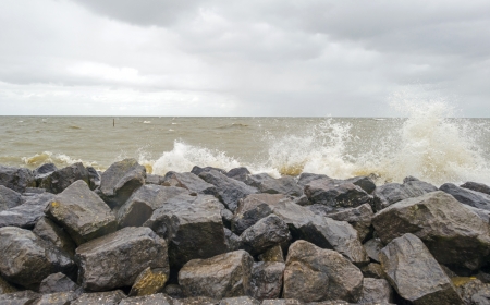 Storm over the coast of a lakeの写真素材
