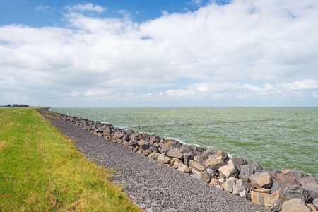 Dike protecting land against waterの写真素材