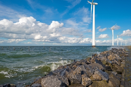 Wind farm in a stormy lakeの写真素材