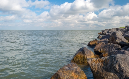Dike along a lake in summer