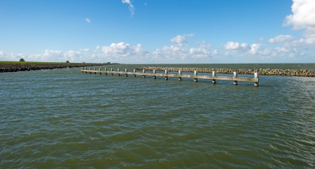 Jetty in a lake in autumnの写真素材
