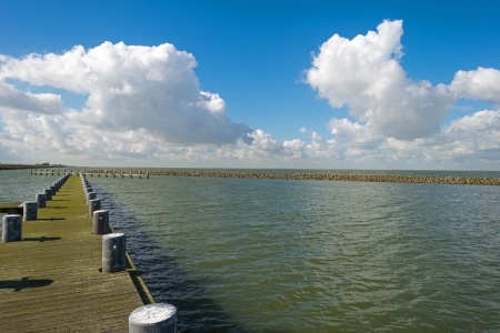 Jetty in a lake in autumnの写真素材
