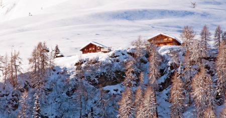 Houses on the slope of a mountain in winter
