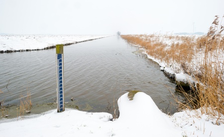Canal through the countryside in winterの写真素材