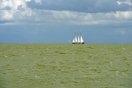 Boat sailing on a lake in summerの写真素材