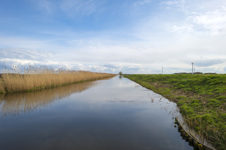 Canal through a rural landscape in springの写真素材