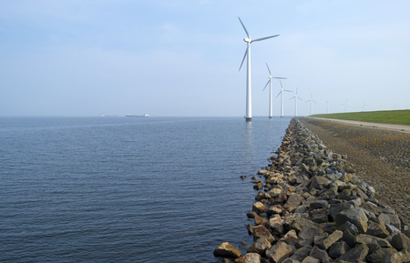 Barge sailing on the horizon of a lake in spring