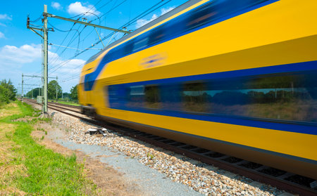 Train riding through the countryside in springのeditorial素材