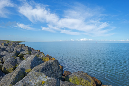 Dike along a lake in summerの写真素材