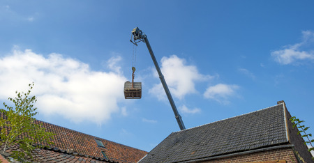 Crane reaching into the blue sky