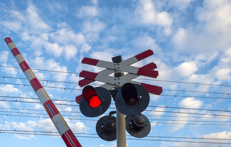 Closing barrier of a rail crossingの写真素材