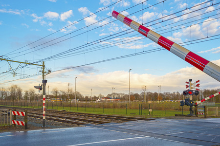 Rail crossing in a city in winterの写真素材