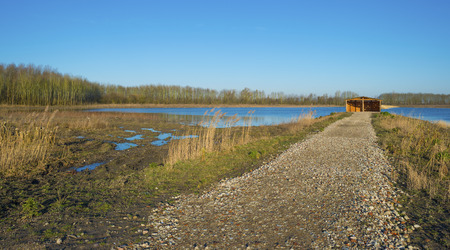 Bird hide along the shore of a lakeの写真素材