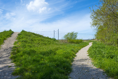 Footpath along a railroad in springの写真素材