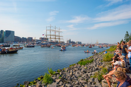 Ships sailing or mooring in the harbor of Amsterdamのeditorial素材