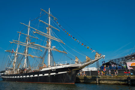 Ships sailing or mooring in the harbor of Amsterdamのeditorial素材