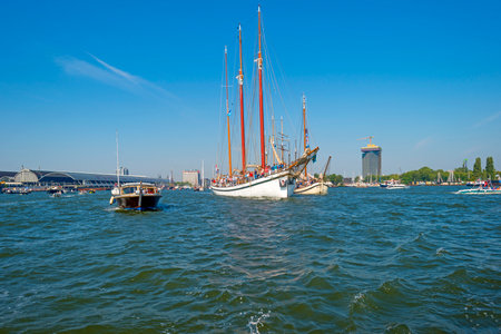 Ships sailing or mooring in the harbor of Amsterdamのeditorial素材