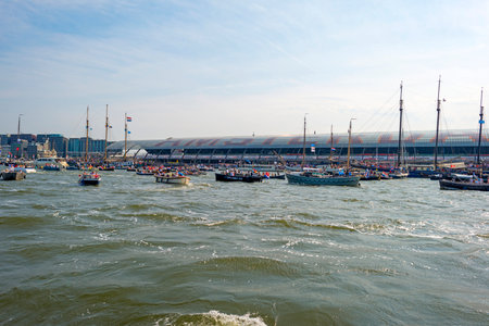 Ships sailing or mooring in the harbor of Amsterdamのeditorial素材