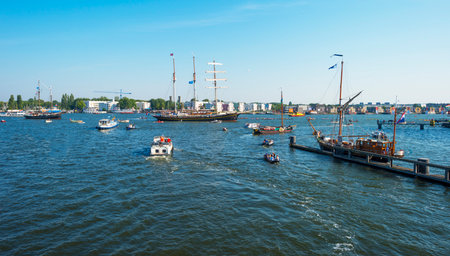 Ships sailing or mooring in the harbor of Amsterdamのeditorial素材