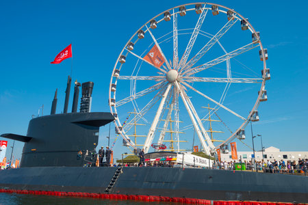 Submarine and ferris wheel in the harbor of Amsterdamのeditorial素材