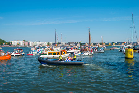 Ships sailing or mooring in the harbor of Amsterdamのeditorial素材