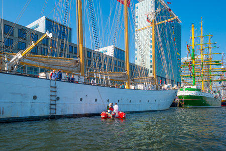 Ships sailing or mooring in the harbor of Amsterdam