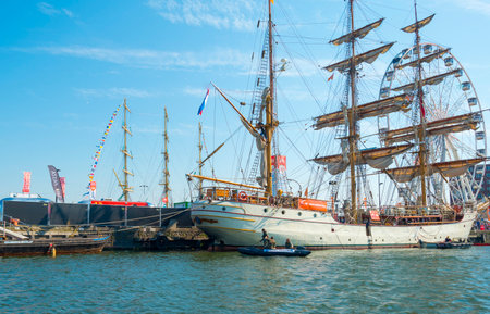 Ships sailing or mooring in the harbor of Amsterdamのeditorial素材