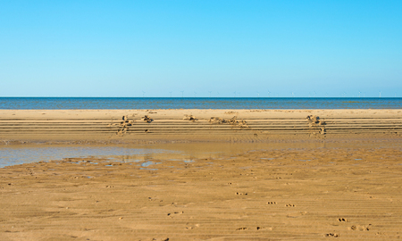 Blue sky on a beach along the North Seaの写真素材