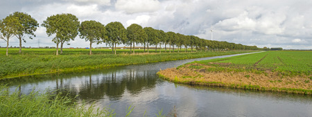 Canal through a rural landscape in summerの写真素材