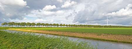 Canal through a rural landscape in summerの写真素材