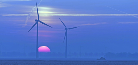 Sunrise over a field in winterの写真素材