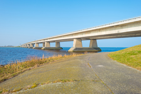 Bridge over a lake in winterの写真素材