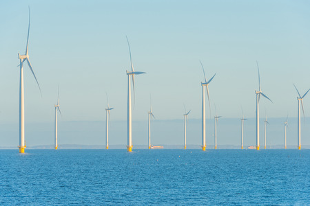 Wind turbines in a lake at sunrise