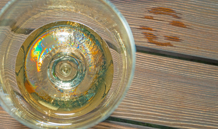 Glass of wine on a wooden tableの写真素材