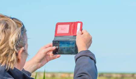 Taking a picture with a mobileの写真素材