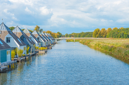 Houseboats in a canal at fallの写真素材