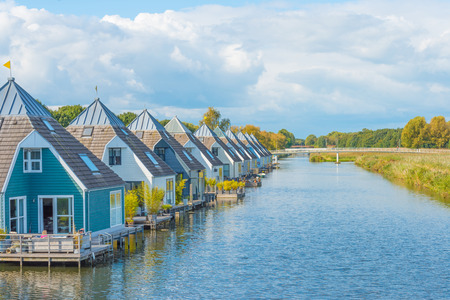 Houseboats in a canal at fallの写真素材