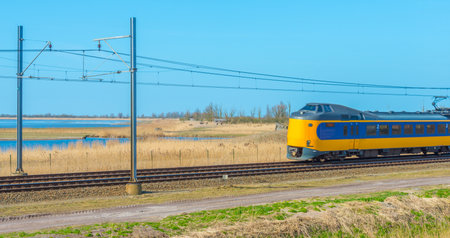 Train riding through nature in winter