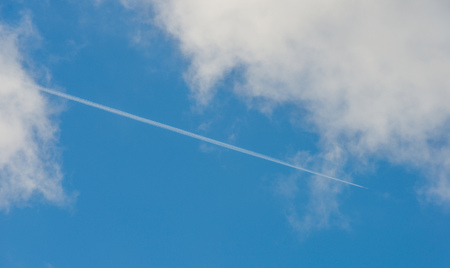 Clouds in a blue sky in springの写真素材