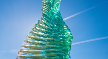 Sunlight playing in a glass sculpture outdoorsの写真素材