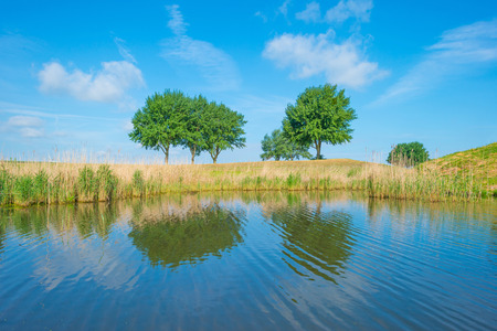 Canal through the countryside in springtimeの写真素材