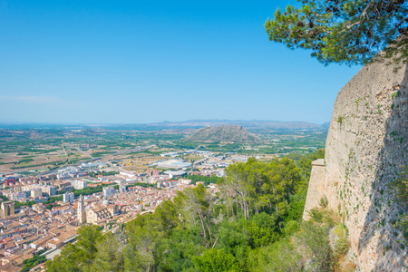 Village seen from a hill in sunlightの写真素材