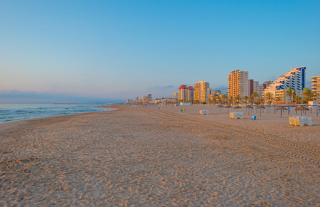 Skyline along a beach in spring at sunrise
