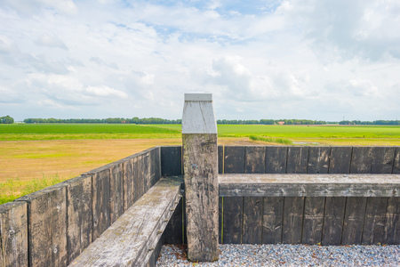 Wooden wall protecting an island against a former seaの写真素材