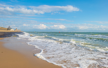 Sandy beach along a sea in sunlight in summerの写真素材